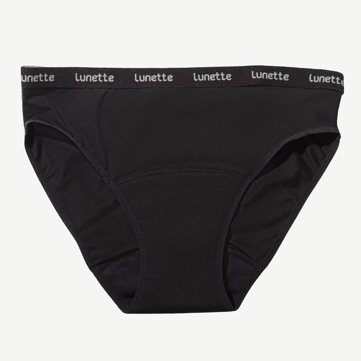 A pair of black Lunette period panties with a wide waistband, made from organic cotton and other materials, designed for comfort and leak protection.
